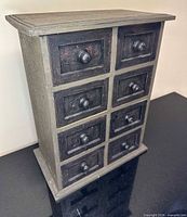 front view of 8-drawer wooden apothecary chest