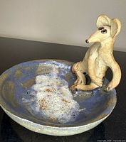 Top view of bowl showing mouse figure and glaze