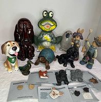 Group shot of all figurines and jewelry laid out on surface