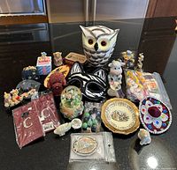 Group shot of entire assorted collectible lot on countertop