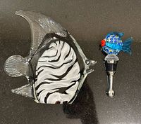 Angelfish sculpture beside bottle stopper