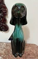 Front view of Blue Mountain Pottery tall Vader dog figurine with hang tag, shows glaze colors and condition