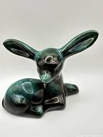 Front view of fawn figurine showing glaze and form