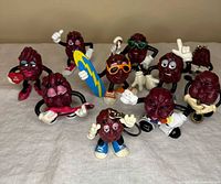 Group shot of all ten California Raisins figurines showing overall variety and condition