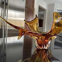 Angled view showing overall freeform shape and amber coloration