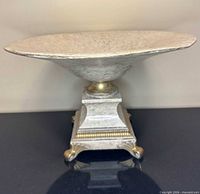 Side profile showing full compote and base