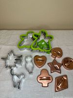 Top view of all eleven cookie cutters showing materials, colors and shapes