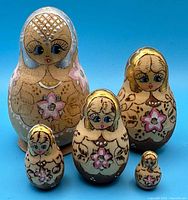 Full 5-piece doll set upright