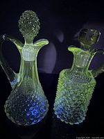 Both cruets glowing green under UV light