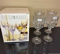 Box and four lead crystal goblets with stickers