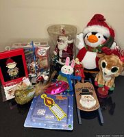 All items grouped showing plush toys, ornaments, CDs, decor and craft kit