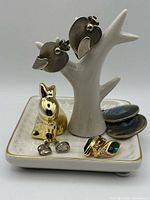 All items: ceramic dish with bunny and four pairs of earrings displayed