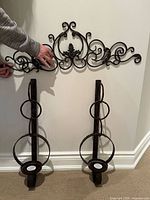 Overview of scroll panel and two sconces