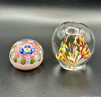 Both paperweights side by side on neutral background