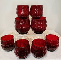 Front view showing all eight ruby red bubble tumblers