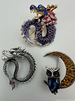 Group shot of all three brooch pins