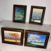 All four small framed landscape paintings grouped for size and condition reference