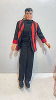 Front view of Jordan Knight Ken doll in signature black and red outfit