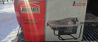 Factory-sealed Jobmate table saw box front showing product image and specs