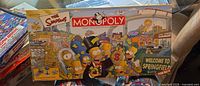 Front of The Simpsons Monopoly box with Springfield graphics