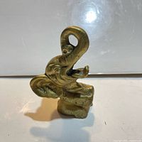 Front view of brass elephant figurine