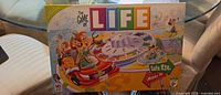 Front of The Game of Life board game box