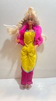 Full view of vintage Barbie doll in bright outfit
