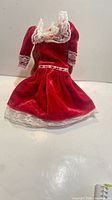 Front view of red velvet Barbie dress with lace trim