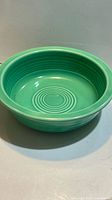 Top angled view of light green Fiesta dipping bowl showing interior and ring pattern