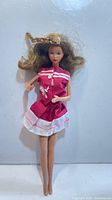 Full view of 1966 Barbie doll wearing pink dress