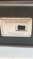 Side panel showing Kodak Cine Automatic Turret Camera f/1.9 label and lock-open switch