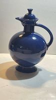 Full view of cobalt blue Fiesta carafe with stopper