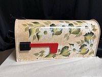 Left side view showing full floral artwork and red flag