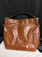 Front view of brown leather Nino Bossi shoulder handbag