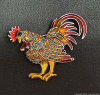 Front view of entire rooster brooch showing rhinestones and enamel colors