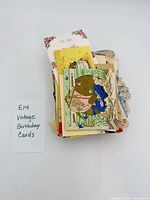 Stack of vintage birthday cards with label E14