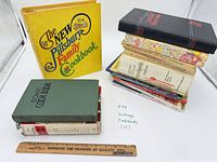 Group shot showing all 15 cookbooks including major titles and stack