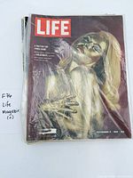 Stack of magazines, top issue November 6 1964 Goldfinger cover