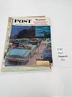 Stack of four The Saturday Evening Post magazines, top issue shows parked convertibles