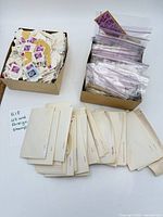 Overview of two boxes of stamps and spread glassine envelopes