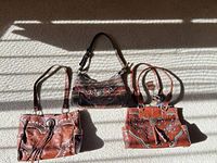 All three American West leather bags displayed together