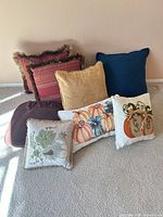 Group shot showing all pillows and seat cushion