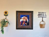 Cowboy print centered with metal sunflower planter and "Happy Trails" basket on either side
