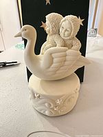 Full view of Snowbabies swan music box assembled
