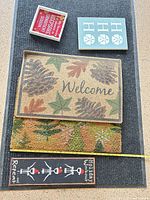 Overview showing both doormats and three signs