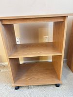 Rolling two-shelf unit on casters