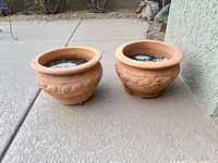 Pair of terracotta planters side by side