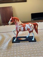 Front view of Sacred Paint figurine on base