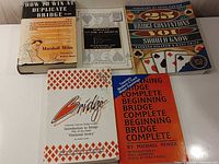 All five bridge books laid out, showing covers