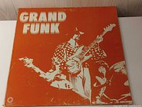 Front cover of Grand Funk Railroad album showing artwork and edge wear